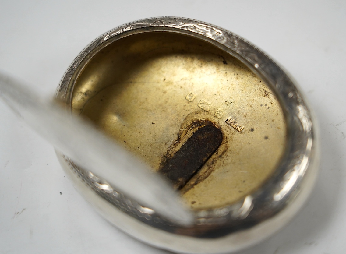 An Edwardian engraved silver oval tobacco box, Hilliard & Thomason, Birmingham, 1901, 75mm. Condition - poor to fair